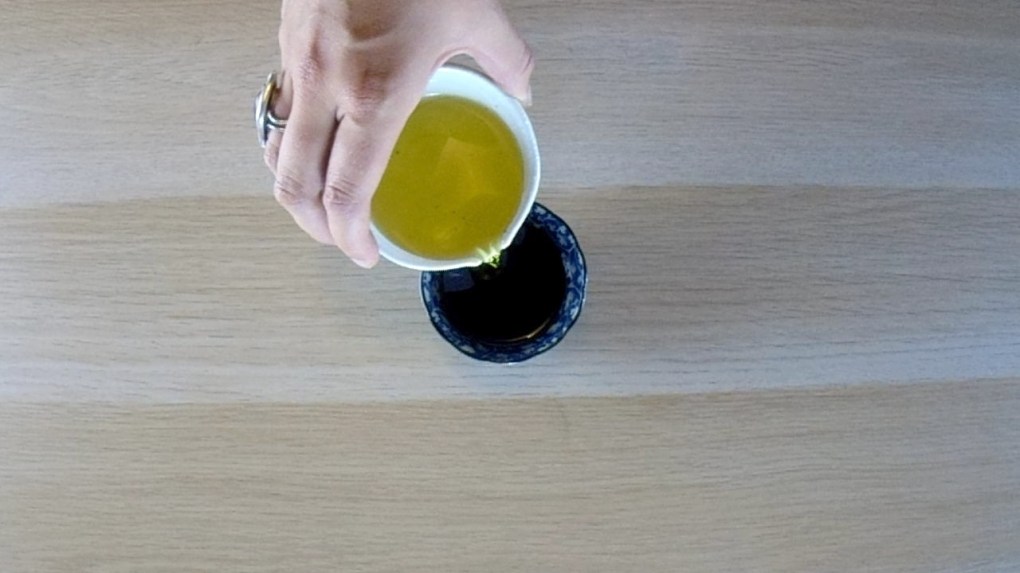 Add olive oil and one tablespoon of balsamic vinegar to a bowl.