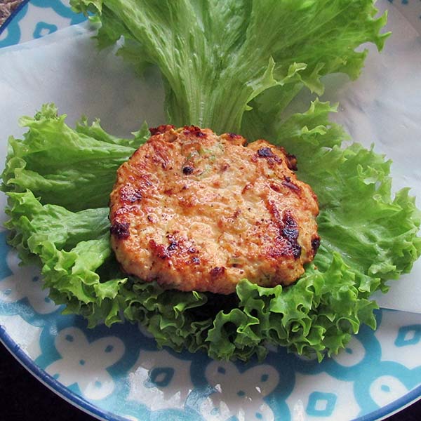 Lemon chicken burger in a lettuce bun.