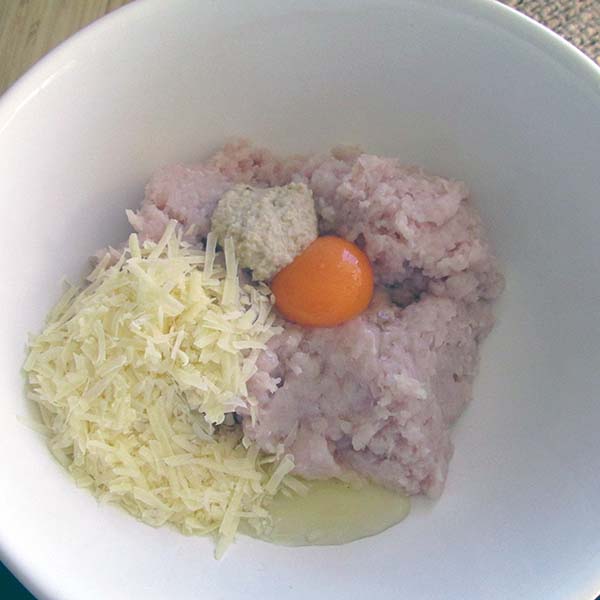 Add the egg, garlic and cheese to the mince.