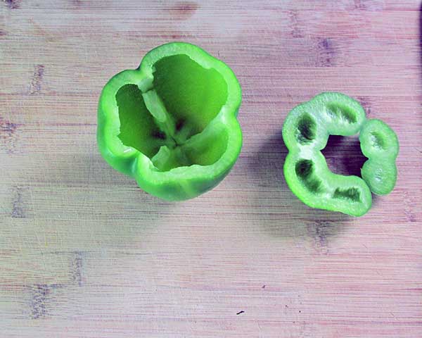 Using your fingers pull out the clump of seeds out of the centre of the pepper.