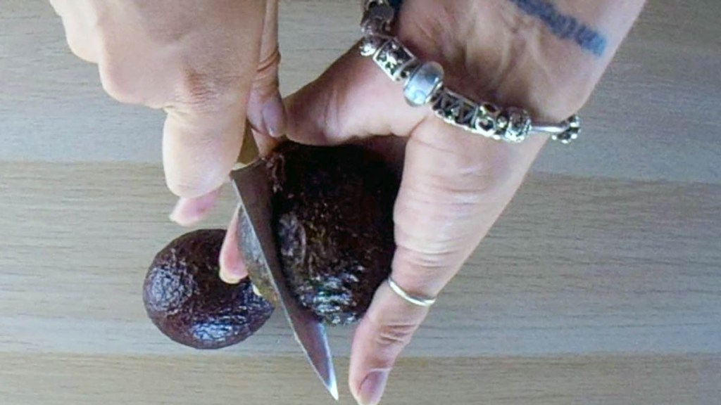 Cut the avocado in half lengthwise 