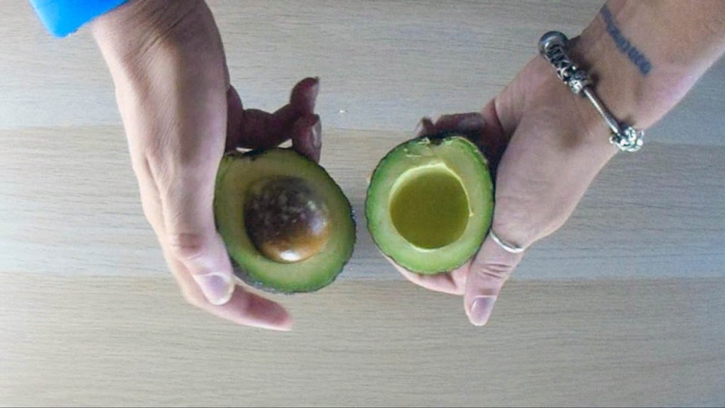 Cut the avocado in half lengthwise 