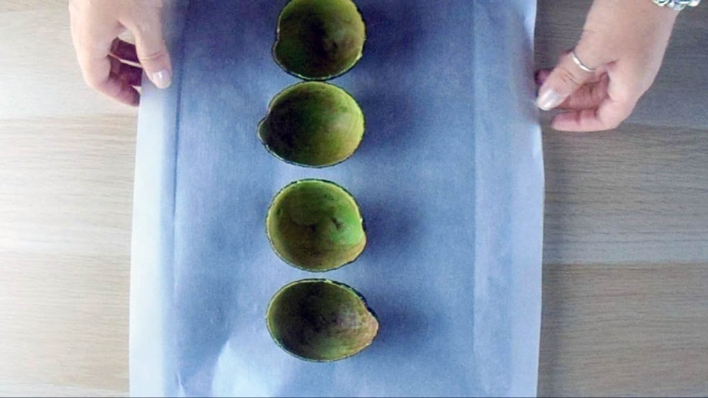 Put the avocado skins on a lined baking tray.