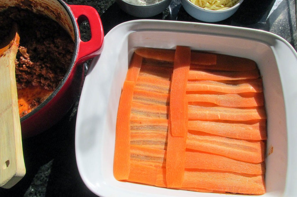 Add another layer of carrot ribbons on top of the meat.