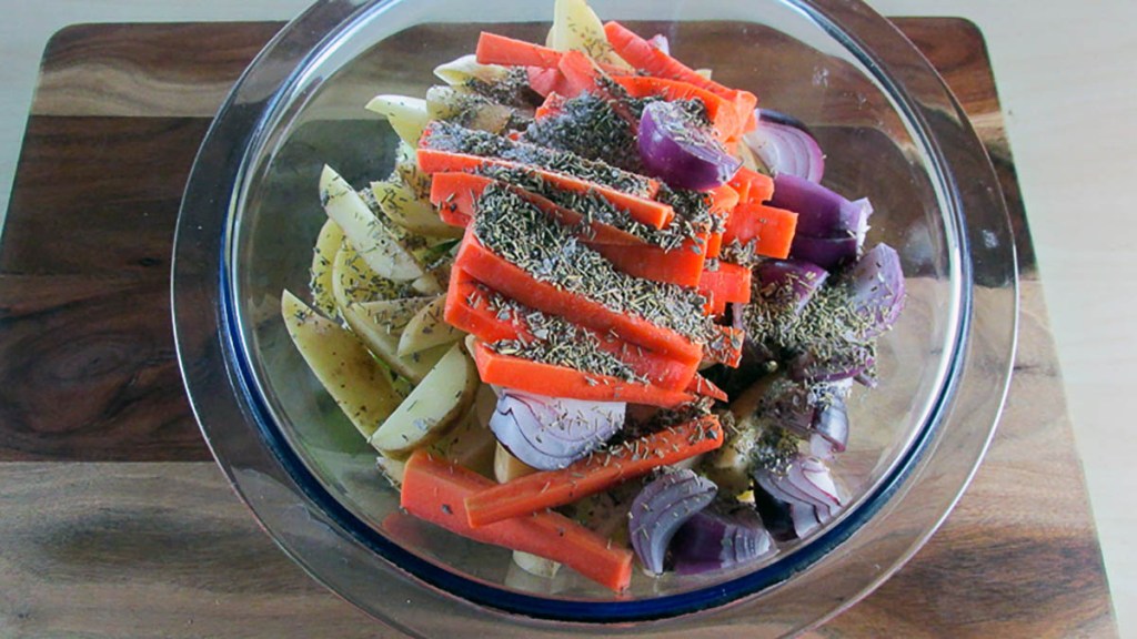 In a large bowl combine the apple, potatoes, carrots and onion with the sage and rosemary.
