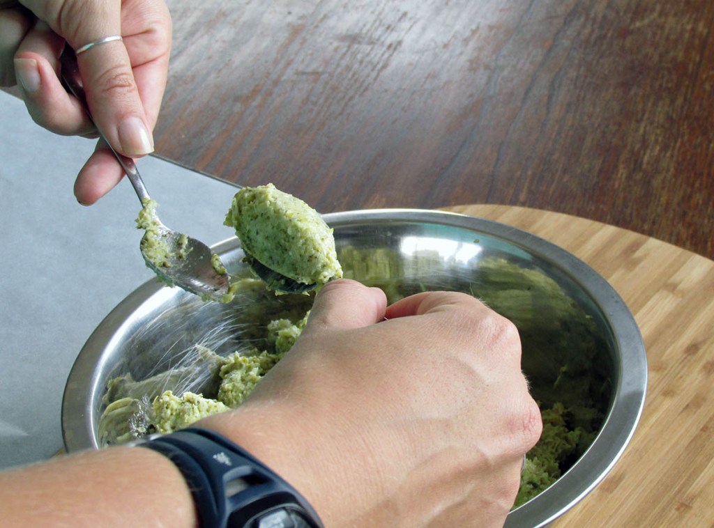 Repeat the transfer of the portion from one spoon to the other gently smoothing the mixture into an oval shape