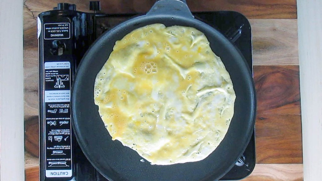 You want the egg as thin as possible without creating holes.