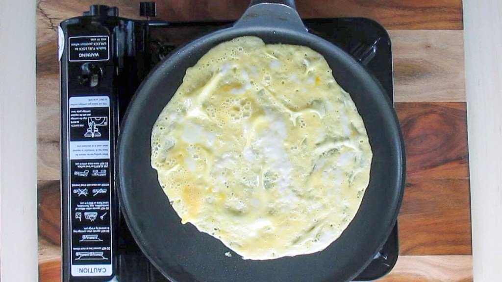 When the edges of the wrap start to lift, use a spatula to turn the wrap over.