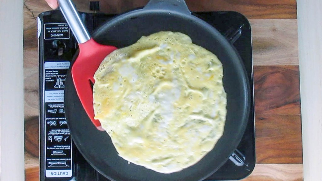 When the edges of the wrap start to lift, use a spatula to turn the wrap over.