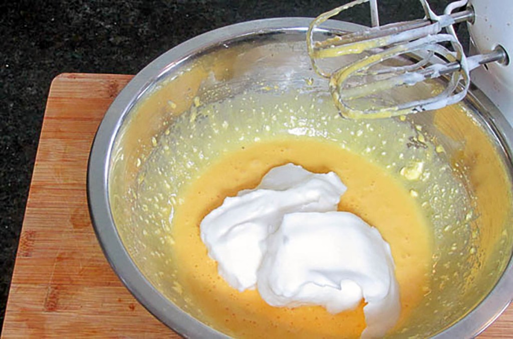 Take one tablespoon of the egg whites and mix it into the egg yolk mix.