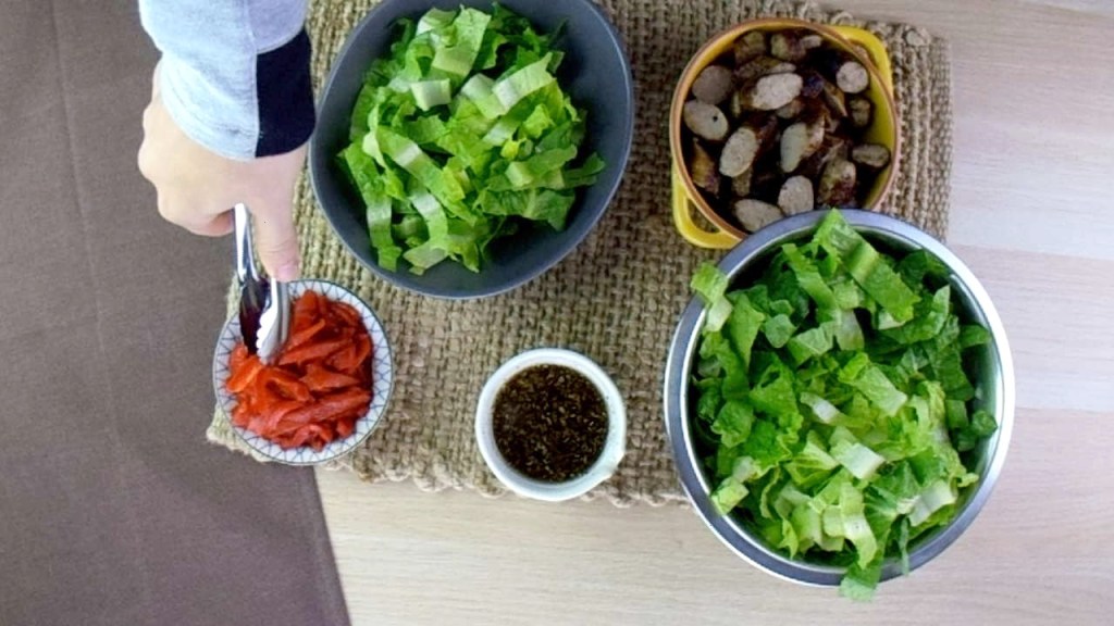 Build the salad starting with the lettuce.