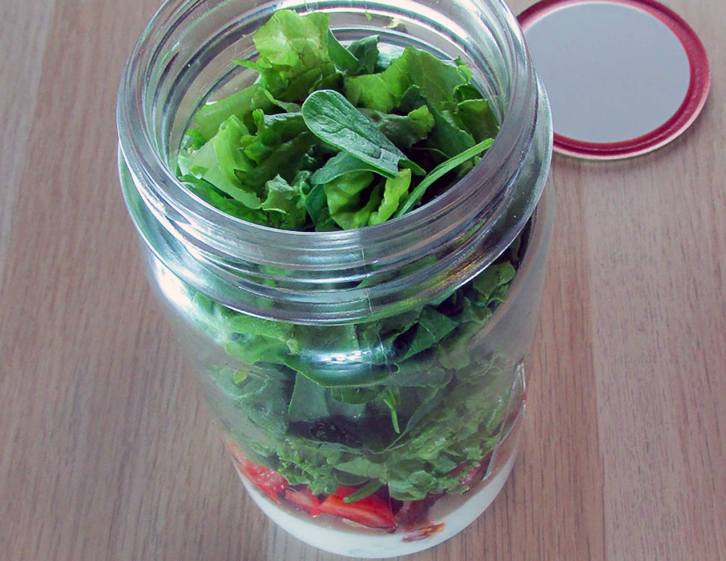 Finally add the lettuce to the jar