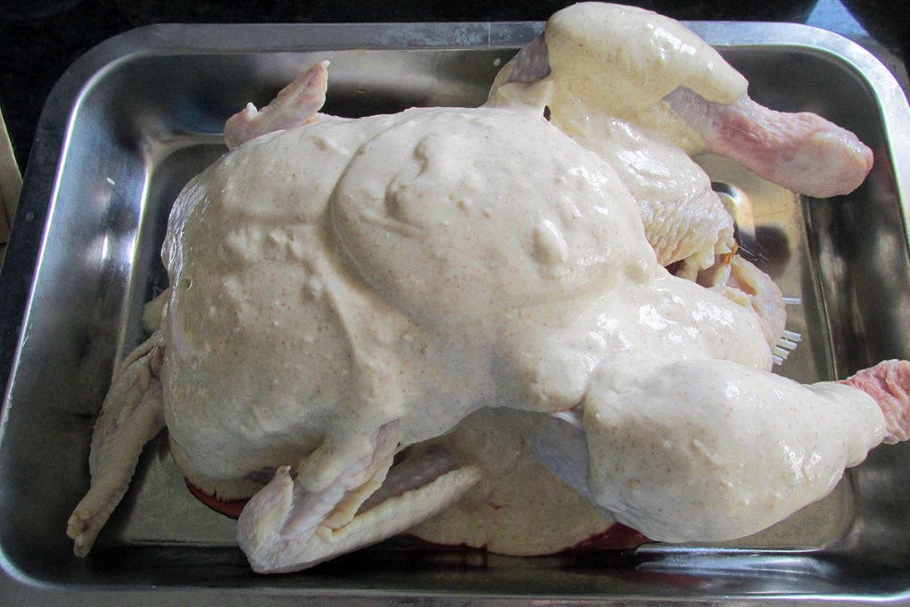 Chicken coated in marinade.