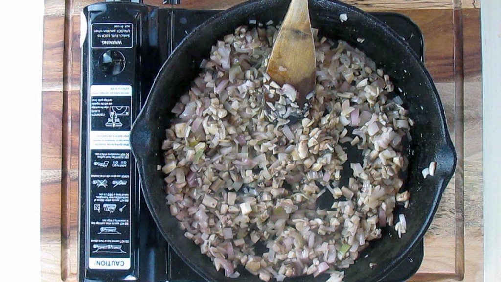 Let the mushrooms and shallots soften.