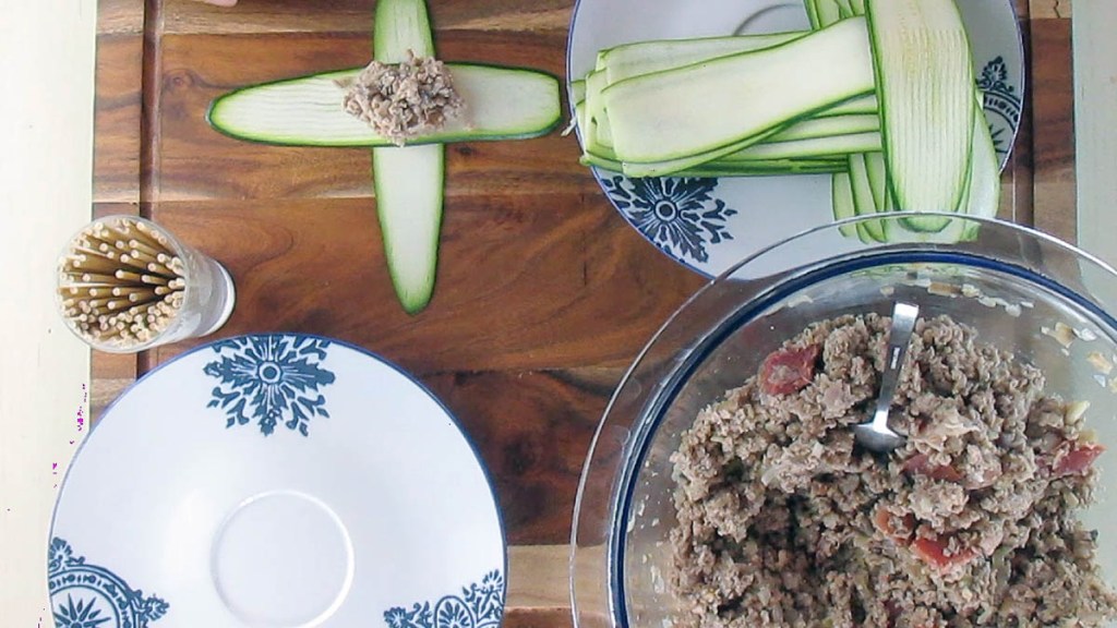 Lay down four courgette ribbons in the shape of a cross, create a weave with the ribbons. Spoon the filling into the centre of the courgettes.

