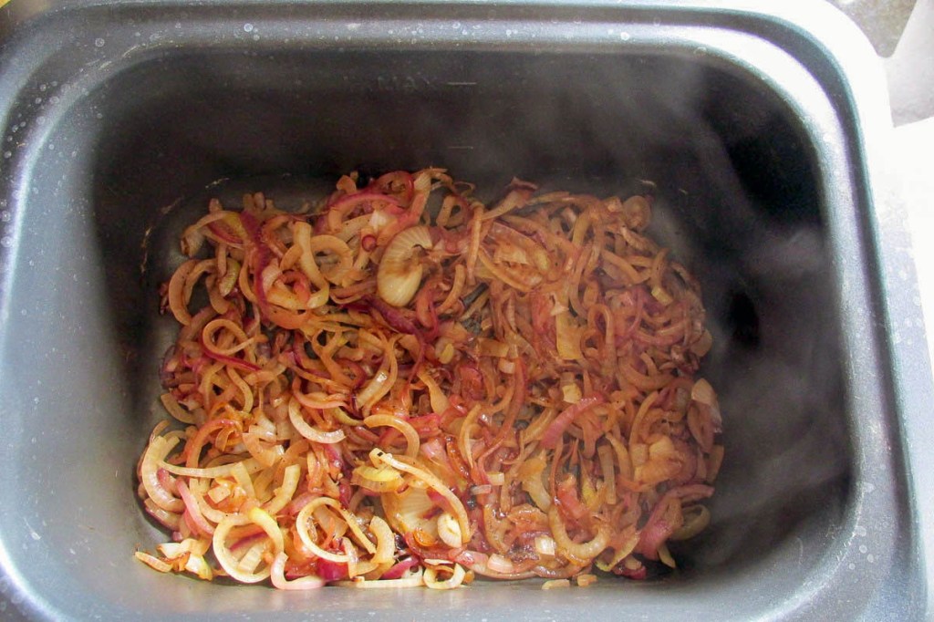 When the onions are caramelised, spread them out on the bottom of your slow cooker.