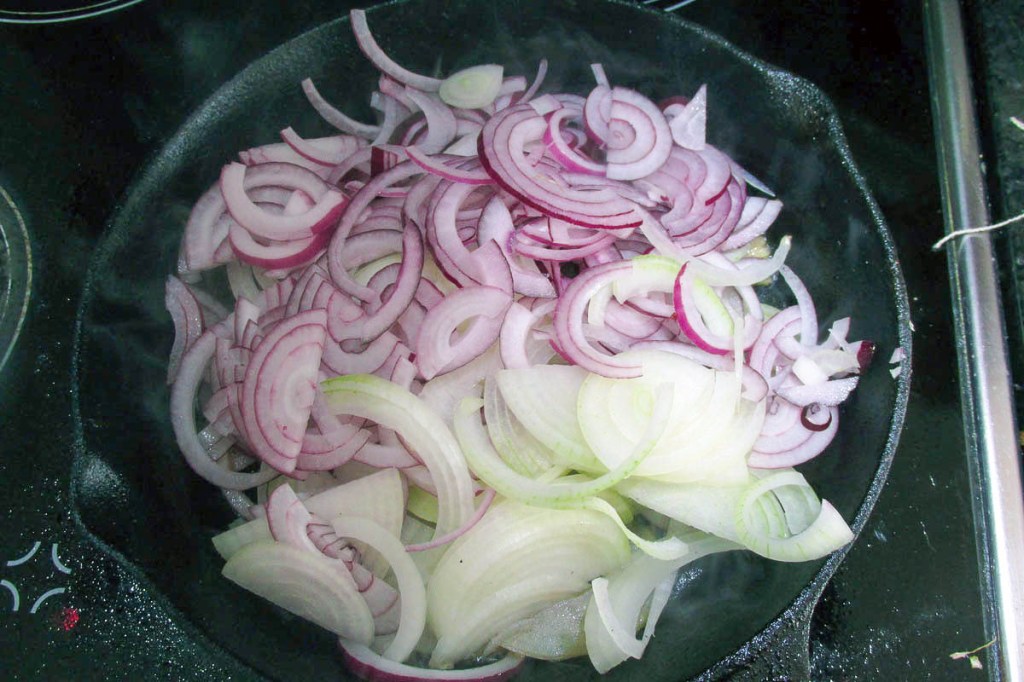 In a large frying pan, heat the olive oil over a medium heat.