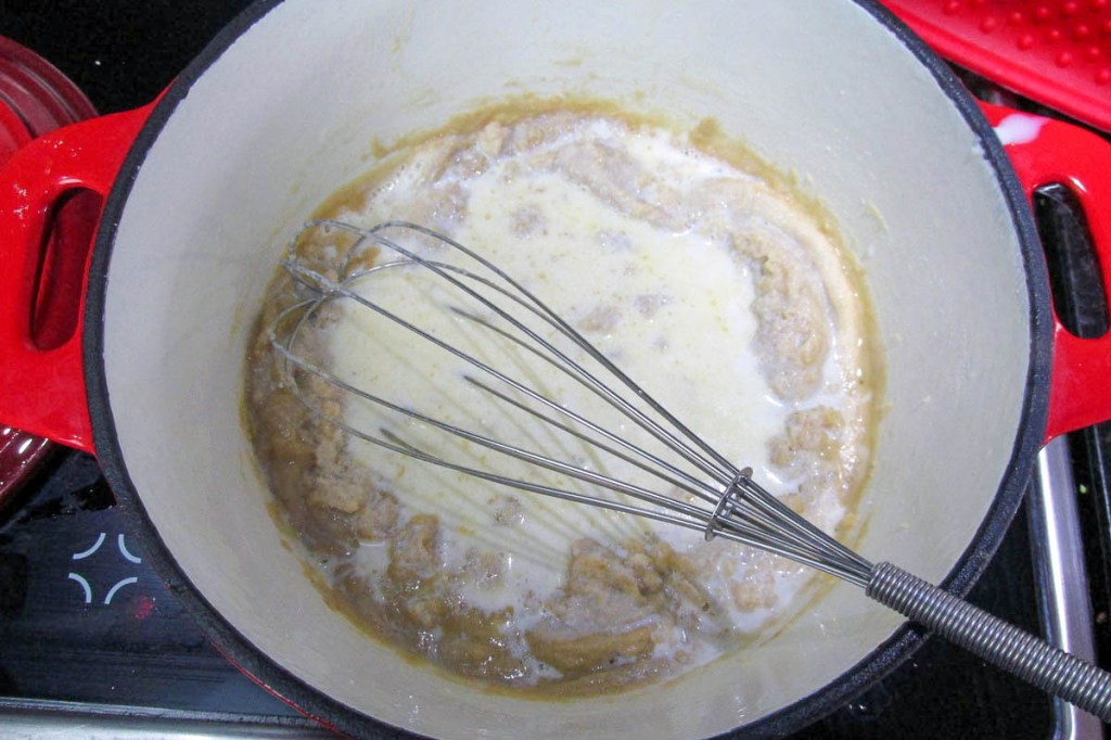 Slowly whisk in the milk. 