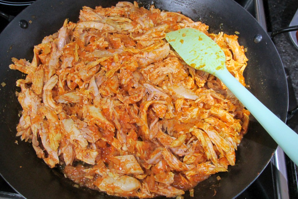 The chicken should be coated in the sauce.