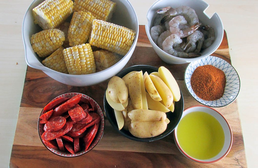 One tray Cajun prawn and sausage bake ingredients