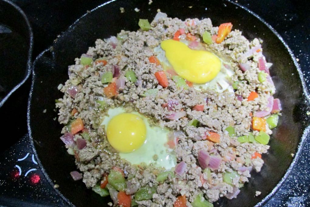 Crack in two eggs to the pan.