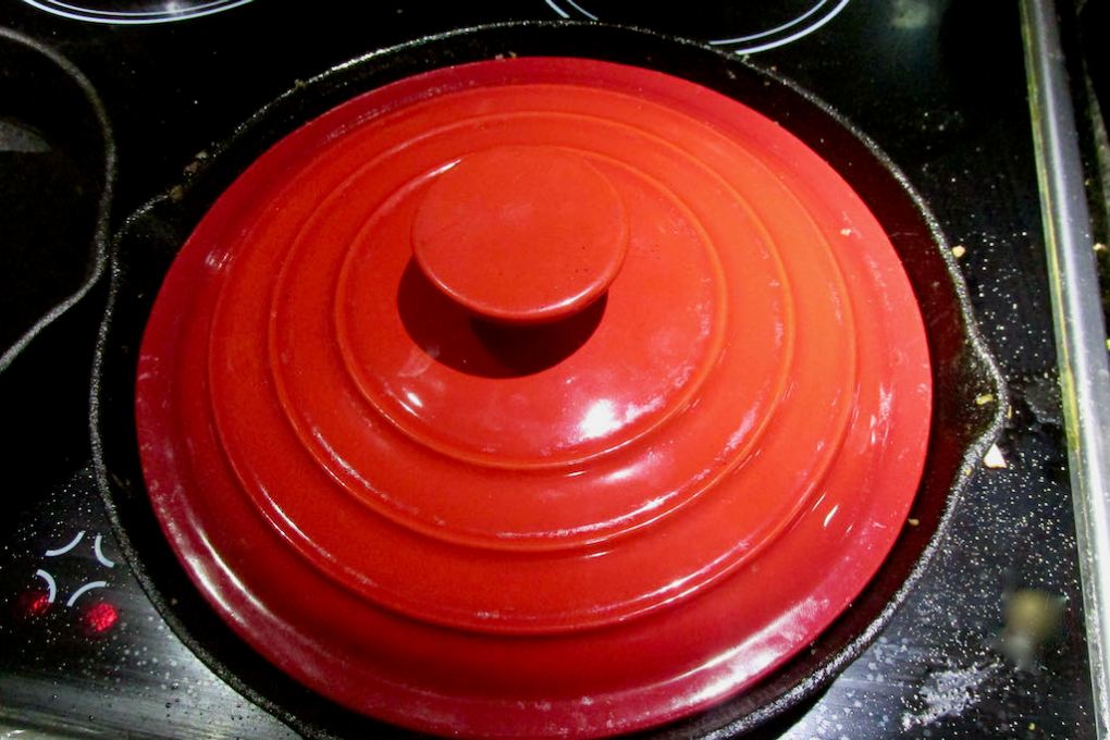Cover the pan with a lid and cook for a few minutes.
