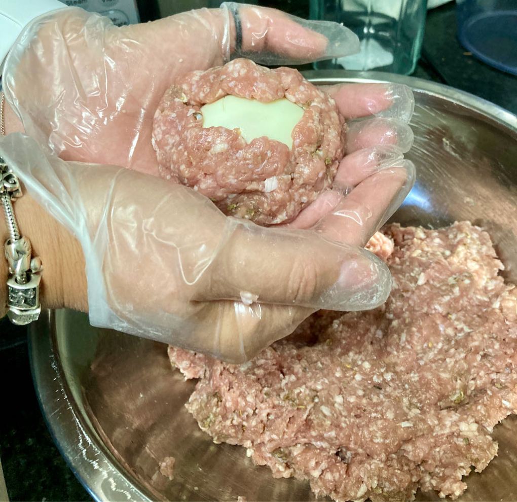 Form the meat around the egg.