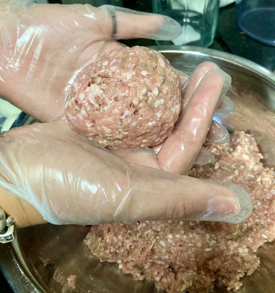 Make sure the meat completely covers the egg.