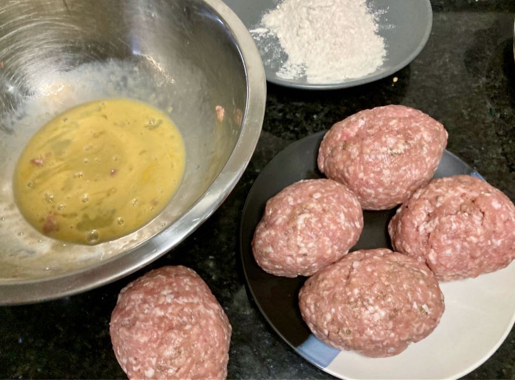 In another bowl beat the two remaining eggs. Place the flour on a plate and season it with some salt and pepper then mix.