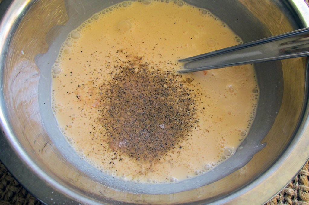 Add the salt and pepper and whisk