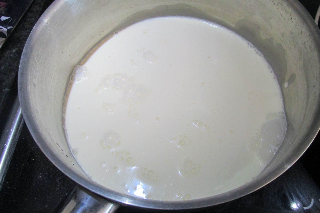 Add the milk and cream to the pan.