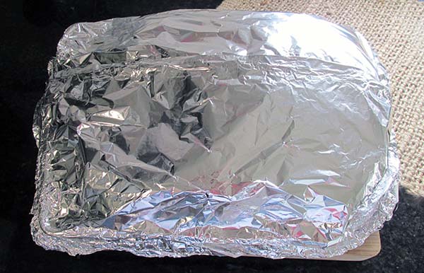 Cover the baking paper with foil.