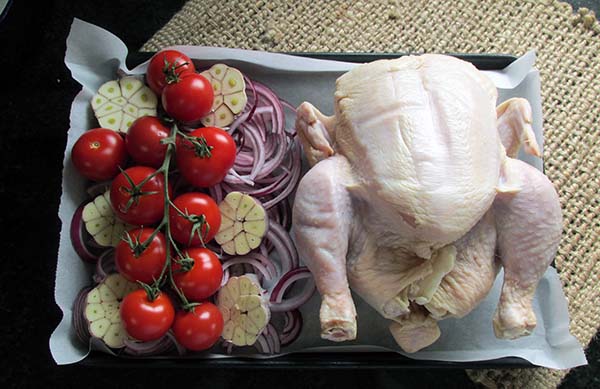 Add the tomatoes on top of the garlic.