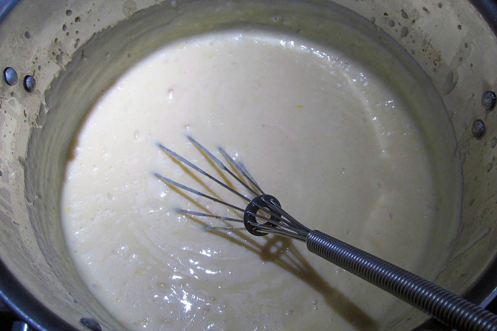 Be patient and keep whisking; the mix will thicken and become pale. 