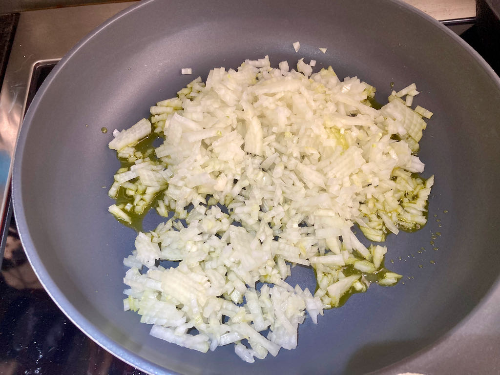 Add the onions to the pan.