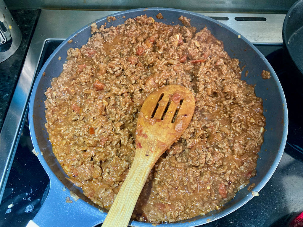 Stir well and simmer until the liquid has reduced by half.