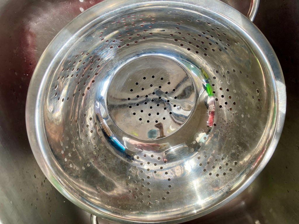 Take a large colander