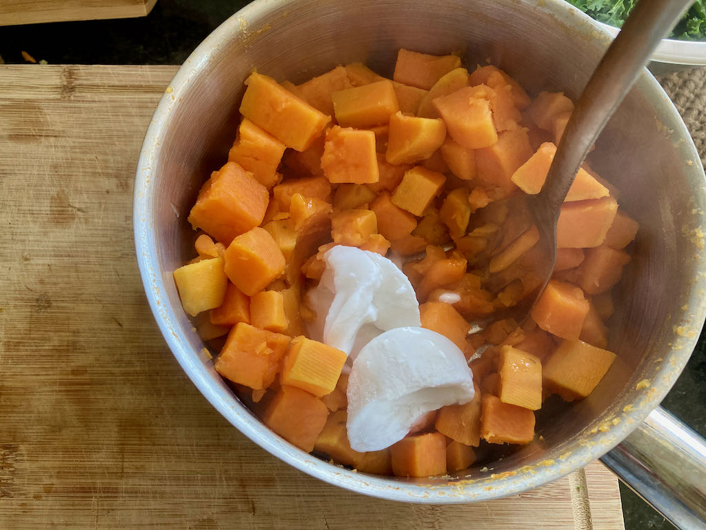Add two tablespoons of coconut cream to the sweet potatoes 