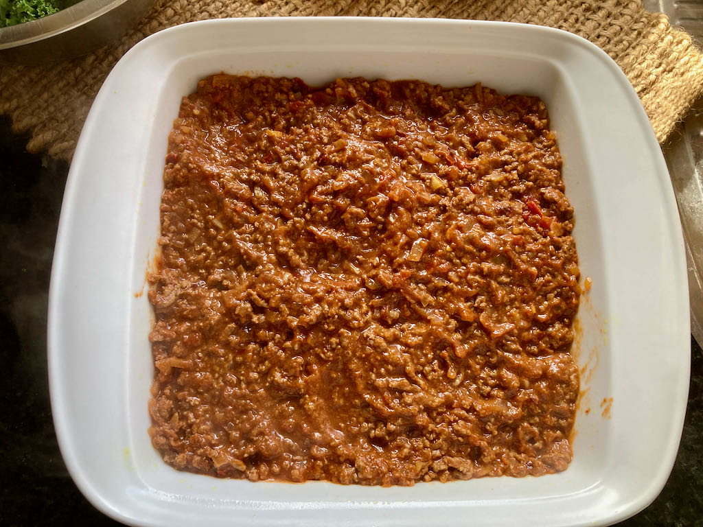 Add the meat to the baking dish.