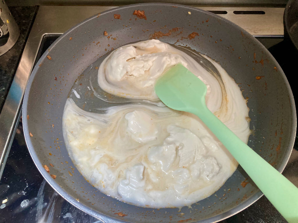 Add the coconut cream to the frying pan.